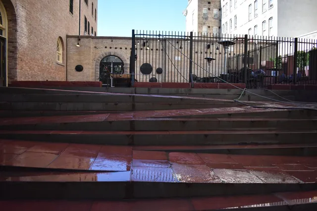 Commercial plaza and wide stone steps being pressure washed